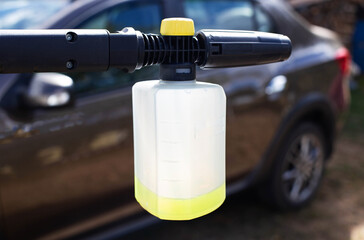 High pressure washer with foam nozzle for cleaning the car with foam. Modern concentrated shampoo.