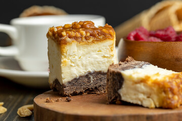 Cheesecake with chocolate sponge cake and peanuts in caramel