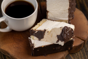 Fresh sweet cake with milk taste and aroma in chocolate glaze