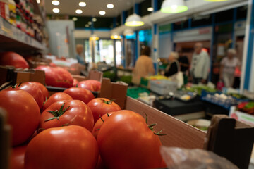 A picture of fresh tomatoes, bell peppers and other vegetables. vegetable stall in the market with fresh vegetables close-up.