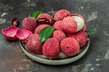 fresh ripe lychee tropical fruit Thailand on a dark background, Food background. Close up