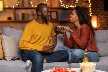 Loving african american husband and wife chilling at home