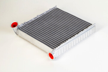 Aluminum radiator of a car stove on a white background, close-up, isolated