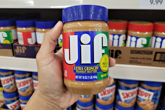PENANG, MALAYSIA - 27 JAN 2023: JIF brand peanut butter spread on store shelf in grocery store, Penang. Jif is an American brand of peanut butter made by The J.M. Smucker Company.