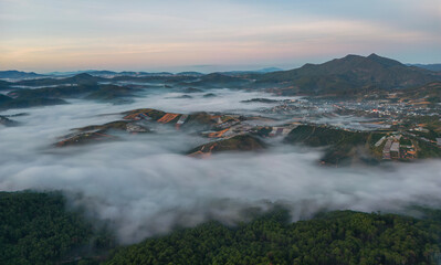 Ariel view of mountain village in mist