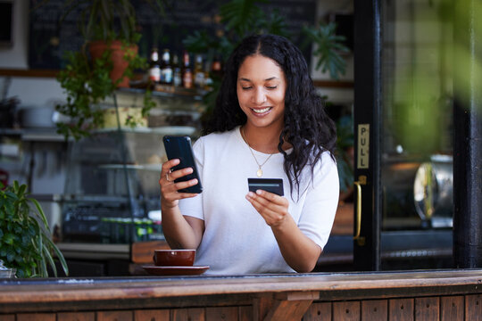 Woman, phone and credit card with smile for ecommerce, online shopping or purchase at coffee shop. Happy female customer on smartphone for internet banking, app or wireless transaction at cafe