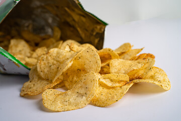 Potato chips, roasted seaweed for crips, thin slice deep fried snack fast food in open bag.