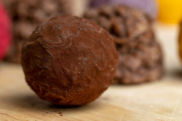 Chocolate sweet candy in the shape of a ball on the table