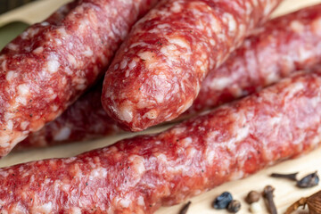 Dried veal sausage during slicing