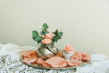 Blush flowers of carnation in a bowl. Still life floral arrangement 