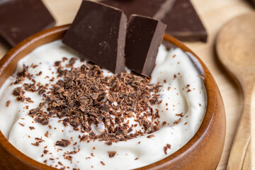 Yogurt made from cream with the addition of chocolate pieces and crumbs
