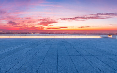 Fototapeta na wymiar Empty square floor and city skyline with sky clouds at sunrise in Shanghai, China.