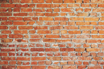 Bricks wall masonry close up with cement. Process of house building and building materials concept. Red bricks laying at construction site. Brick wallpaper pattern