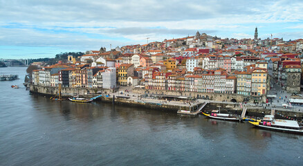 Fototapeta na wymiar Porto, Portugal - 12.25.2022: Aerial view of the old city of Porto. Portugal old town ribeira aerial promenade view with colorful houses. High quality photo