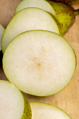 Fresh juicy pear cut into pieces and pieces