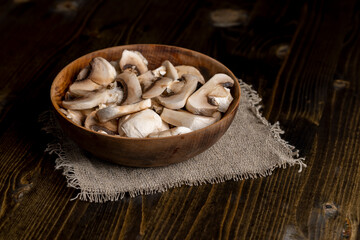 Peeled, washed and cut mushrooms champignons during cooking