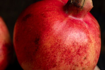 Red ripe pomegranate with red and juicy grains