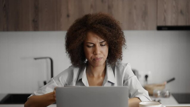 Woman having credit card declined during online shopping, financial problems