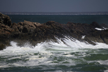 Ocean waves crashing on a rocky shore