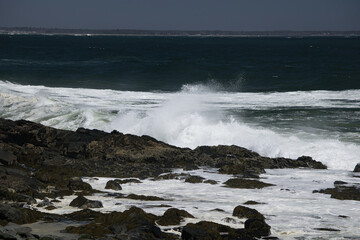 Ocean waves crashing on a rocky shore
