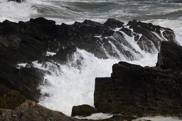 Ocean waves crashing on a rocky shore
