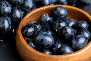 washed ripe black grapes covered with drops of water