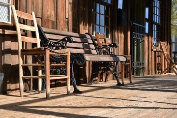 Fototapeta na wymiar Wooden bench on a wooden porch