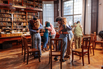 Patients hugging in group therapy.