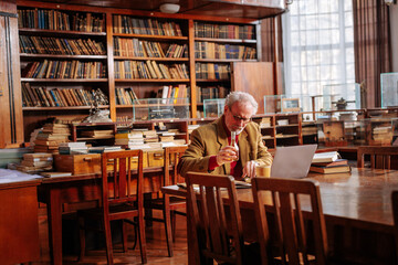 College professor in library.