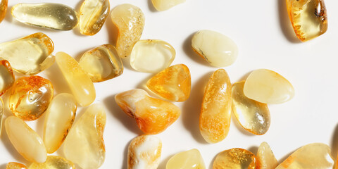 Natural gemstone amber texture background, aesthetic nature stones yellow ivory white colors....