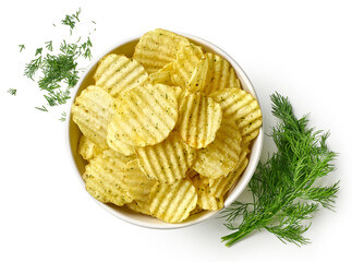 Bowl of crispy wavy potato chips or crisps with dill flavor