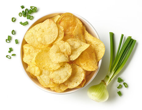 Bowl of crispy potato chips or crisps with spring onions