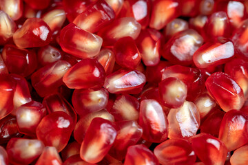 Red ripe pomegranate with red and juicy grains