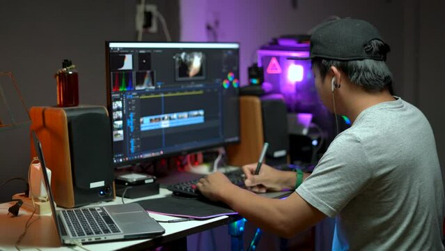 Content creator working with computer for editing video footage