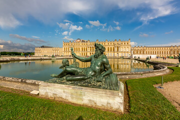 Fototapeta na wymiar Versailles palace and Neptune statue, Paris, France