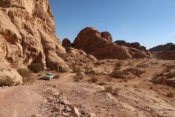 Abandoned vehicle, car on the desert hiking trail from Little Petra to the Monastery