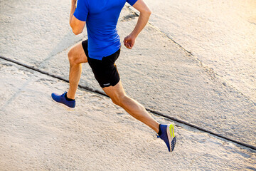 close-up male runner athlete running