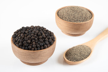 Ground black pepper with grains of black pepper on a white background,top view