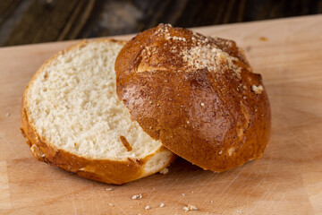 Wheat bun with large pieces of processed cheese inside