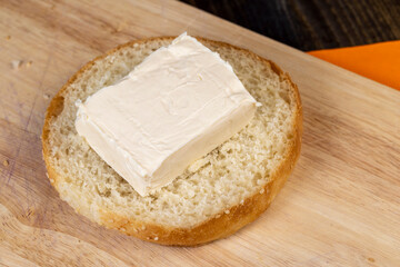 Wheat bun with large pieces of processed cheese inside