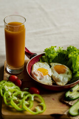 nice breakfast, scrambled eggs and a glass of fresh juice