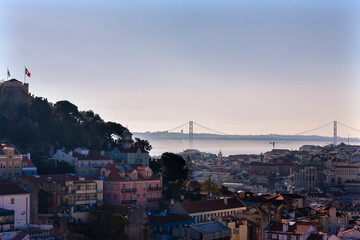 View over the city centre from the Miradouro da Graça, Lisbon, Portugal, with St George's Castle (Castelo de São Jorge) on the left and the Tagus river in the distance 