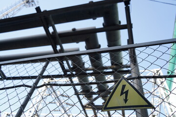 High voltage sign on the territory of the power plant