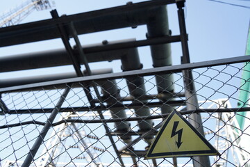 High voltage sign on the territory of the power plant