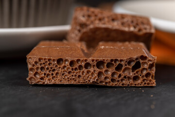 A piece of chocolate bar with air bubbles