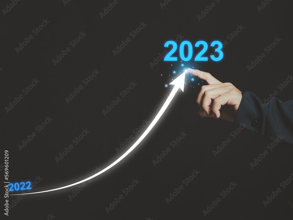 Poster arrow from 2022 to 2023. businessman drawing line arrows from 2022 to 2023. business startup. new co