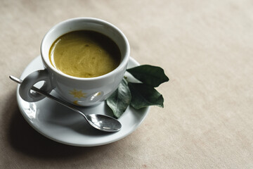 cup of coffee with milk and mint syrup