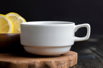 Green tea in a white cup during its brewing