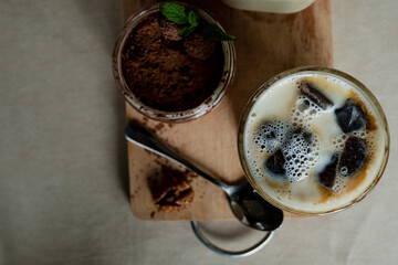 Milk bottle, tiramisu with strawberry frozen coffee with milk, delicious breakfast