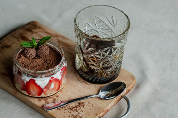 frozen coffee in a faceted glass, tiramisu with strawberries